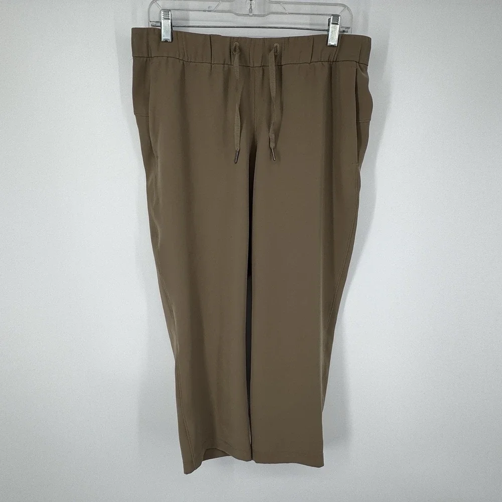 Lululemon‎ On The Fly Crop Pants Size 10 Khaki Woven Drawstring Stretch Casual
